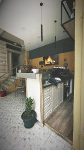 a kitchen with a counter with a fire in it at BELUX HOTEL in Tirana