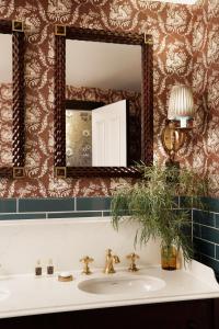 a bathroom with a sink and a mirror at Rusacks St Andrews in St. Andrews