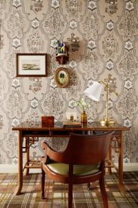 an office with a desk with a chair and wallpaper at Rusacks St Andrews in St. Andrews