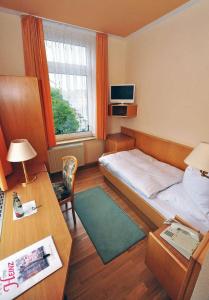TV a/nebo společenská místnost v ubytování Hotel Heinz