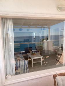a view of a living room through a window at Casa Tito in Puerto del Carmen +26 photos