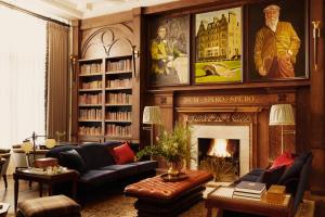 a living room with a couch and a fireplace at Rusacks St Andrews in St. Andrews
