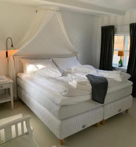 מיטה או מיטות בחדר ב-Två Små Svin BnB