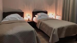 Postel nebo postele na pokoji v ubytování Atlant Hotel + 37 fotografií