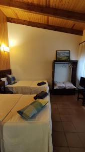 Postel nebo postele na pokoji v ubytování Hostal Escartín