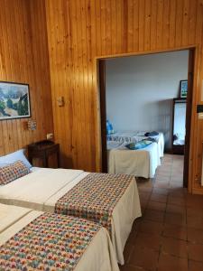 Postel nebo postele na pokoji v ubytování Hostal Escartín