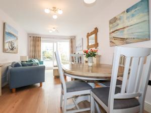 a dining room with a table and chairs at 16 Ocean Heights in Newquay