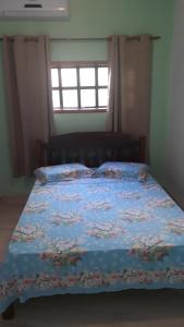 Ein Bett oder Betten in einem Zimmer der Unterkunft Chalé e suite Manu