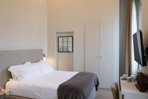 Posteľ alebo postele v izbe v ubytovaní Domus 21 Luxury Suites
