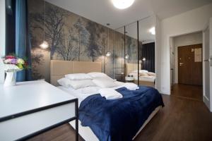 Posteľ alebo postele v izbe v ubytovaní Marina Mokotow P&O Serviced Apartments