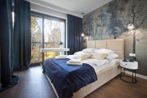 Posteľ alebo postele v izbe v ubytovaní Marina Mokotow P&O Serviced Apartments