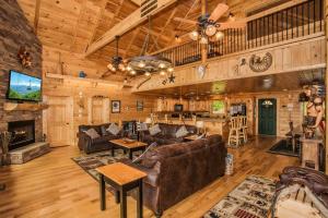a living room with a couch and a fireplace at Cloud Dancer in Gatlinburg