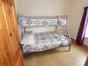 a bedroom with two bunk beds in a room at Georges Street in Killala