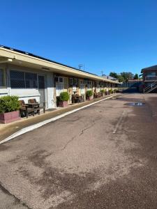 an empty parking lot in front of a building at Maitland City Motel in Maitland