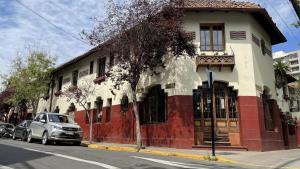 a car parked in front of a building on a street at Studio 522 in Santiago