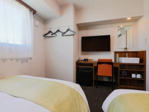 Postel nebo postele na pokoji v ubytování Hotel Wing International Takamatsu