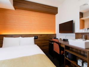 Postel nebo postele na pokoji v ubytování Hotel Wing International Takamatsu