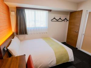 Postel nebo postele na pokoji v ubytování Hotel Wing International Takamatsu
