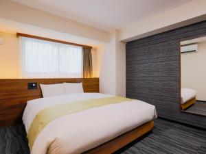 Postel nebo postele na pokoji v ubytování Hotel Wing International Takamatsu