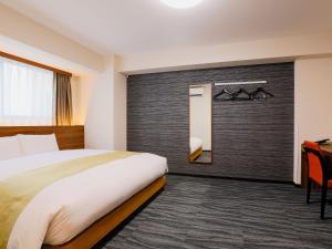 Postel nebo postele na pokoji v ubytování Hotel Wing International Takamatsu