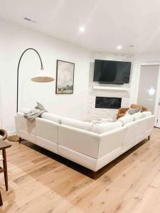 a white couch in a living room with a fireplace at 110 Downtown in Provo