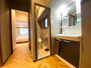 Koupelna v ubytování TABISAI HOTEL Suite 博多