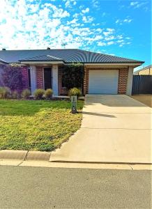 a house with a garage and a driveway at My Abode in Albury in Albury