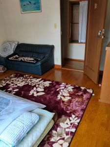 Postel nebo postele na pokoji v ubytování 町中ステイ 宗ハウス