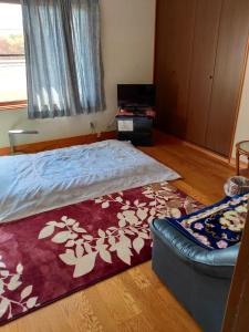 Postel nebo postele na pokoji v ubytování 町中ステイ 宗ハウス