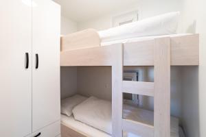 a room with two bunk beds in a room at The Sea Lodges Portoroz - Bootshaus Floating Sea House in Portorož