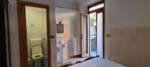 Ένα ή περισσότερα κρεβάτια σε δωμάτιο στο Albergo Avalon