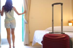 Letto o letti in una camera di Hotel Castel Miramonti