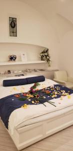 a bedroom with a bed with flowers on it at Hotel First (Adult Only) in Ikeda