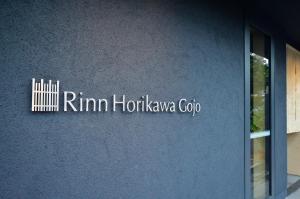 a sign on the side of a building at Rinn Horikawa Gojo in Kyoto +30 photos