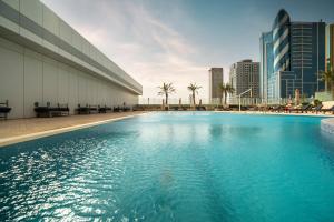 The swimming pool at or close to Aparthotel Adagio Fujairah