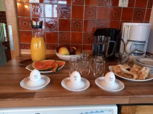 a kitchen counter with eggs on plates on a table at Haus zur Linde in Wagrain