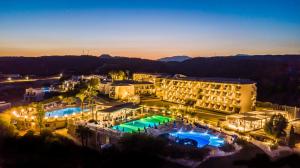 an aerial view of a resort at night at Princess Sun Hotel in Kiotari