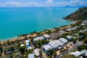 an aerial view of a resort next to the ocean at Costa Royale Beachfront Apartment in Trinity Beach