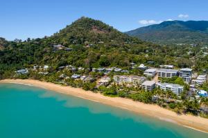 an aerial view of a resort on a beach at Costa Royale Beachfront Apartment in Trinity Beach