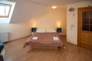 Postel nebo postele na pokoji v ubytování Apartmán a ubytování U Machů