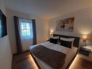 Posteľ alebo postele v izbe v ubytovaní Hochalmbahnen Chalets Rauris 1-10 WE1, Maislaufeldweg 1j EG
