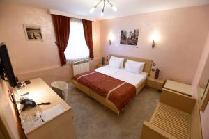 Voodi või voodid majutusasutuse Euro Garni Hotel toas