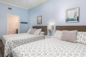 מיטה או מיטות בחדר ב-Phoenix Gulf Shores
