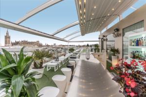 a restaurant with a view of the city at Hotel Inglaterra in Seville