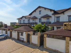 a row of houses with a car parked in front at Villa Bugaz in Zatoka