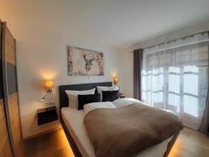 Posteľ alebo postele v izbe v ubytovaní Hochalmbahnen Chalets Rauris 1-10 WE1, Maislaufeldweg 1j EG