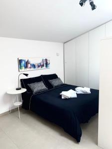 Postel nebo postele na pokoji v ubytování Luminos Quaroni
