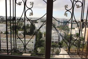 a window with a view of a city at Appartement Alain savary in Tunis