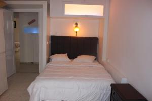Säng eller sängar i ett rum på Appartement Alain savary