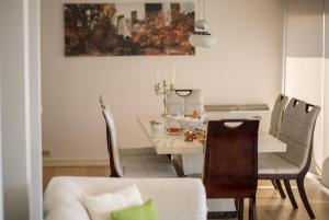 a living room with a table and a dining room at Spa Resort Luxury Apartments in Budva
